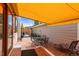 Charming brick patio with awning, perfect for relaxing and outdoor dining at 8040 E Dartmouth Ave # 16, Denver, CO 80231