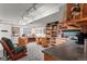A finished basement with a workspace, cabinets, and a small kitchenette at 8040 E Dartmouth Ave # 16, Denver, CO 80231
