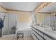 Well-maintained bathroom featuring a shower, tub, and a double sink vanity at 8040 E Dartmouth Ave # 16, Denver, CO 80231