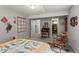 This bedroom has neutral walls and flooring and an adjoining walk-in closet at 8040 E Dartmouth Ave # 16, Denver, CO 80231
