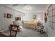 Bright bedroom with neutral walls and flooring, large window, and a colorful quilt at 8040 E Dartmouth Ave # 16, Denver, CO 80231