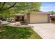 Charming single-story home with an attached two-car garage and a well-manicured lawn at 8040 E Dartmouth Ave # 16, Denver, CO 80231