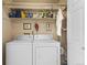Convenient laundry room equipped with a washer, dryer, and ample storage space at 8040 E Dartmouth Ave # 16, Denver, CO 80231