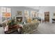 Cozy living room with a fireplace, large windows and an adjacent dining area at 8040 E Dartmouth Ave # 16, Denver, CO 80231