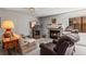 Bright living room with fireplace, comfortable seating, and ample natural light at 8040 E Dartmouth Ave # 16, Denver, CO 80231