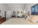Serene bedroom featuring a king bed, a private bath and sitting area at 8040 E Dartmouth Ave # 16, Denver, CO 80231