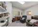 Cozy home office with natural light, built-in bookshelves, and comfortable seating at 8040 E Dartmouth Ave # 16, Denver, CO 80231