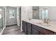 Double vanity bathroom with a quartz countertop and separate shower at 17791 E 93Rd Ave, Commerce City, CO 80022