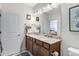Bathroom featuring double vanity with granite counters and a large mirror at 23743 E Ida Pl # E, Aurora, CO 80016