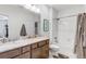 Bright bathroom features dual sinks, granite vanity, tub-shower combo, and white subway tile at 23743 E Ida Pl # E, Aurora, CO 80016