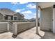 A covered patio offers serene views of the surrounding neighborhood and blue skies at 23743 E Ida Pl # E, Aurora, CO 80016