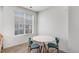 An airy dining area featuring a sleek table and chairs bathed in natural light at 23743 E Ida Pl # E, Aurora, CO 80016