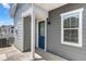 A charming entrance with a blue door and white trim offers a warm welcome at 23743 E Ida Pl # E, Aurora, CO 80016