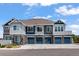 Townhome featuring a two-story facade, private garages, and inviting curb appeal at 23743 E Ida Pl # E, Aurora, CO 80016