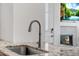 Close-up of a modern kitchen sink with granite countertops and stainless steel faucet at 23743 E Ida Pl # E, Aurora, CO 80016