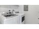 Bright laundry room with modern washer and dryer at 23743 E Ida Pl # E, Aurora, CO 80016