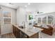 Open-concept kitchen flows into a living room, stainless dishwasher, and granite counters at 23743 E Ida Pl # E, Aurora, CO 80016