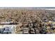 Aerial view of a neighborhood with mature trees, businesses and residential properties at 3233 Meade St, Denver, CO 80211