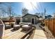 Backyard with outdoor seating area, hot tub and decorative lighting at 3233 Meade St, Denver, CO 80211