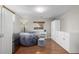 Basement recreation room featuring a comfortable beanbag chair, mini-fridge, and wood-look flooring at 3233 Meade St, Denver, CO 80211