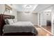 Bedroom featuring laminate flooring, neutral decor, and access to an adjacent space at 3233 Meade St, Denver, CO 80211