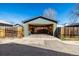 Open garage with concrete floor, storage shelving, workbench and room for multiple vehicles at 3233 Meade St, Denver, CO 80211