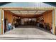 Spacious two-car garage with ample storage and workshop space; equipped with shelving and lighting at 3233 Meade St, Denver, CO 80211