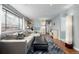 Comfortable living area with a sofa, hardwood flooring, and neutral decor at 3233 Meade St, Denver, CO 80211