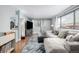 Open living room showcasing hardwood floors and plenty of natural light at 3233 Meade St, Denver, CO 80211