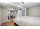 Main bedroom with laminate flooring, neutral colors, and access to other rooms at 3233 Meade St, Denver, CO 80211
