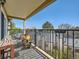 Cozy balcony featuring a seating area and outdoor decor with neighborhood views under a bright blue sky at 15911 E Dakota Pl # 301, Aurora, CO 80017