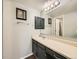 Well-lit bathroom features a vanity with modern fixtures and a shower/tub combo at 15911 E Dakota Pl # 301, Aurora, CO 80017