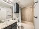 Bathroom with vanity and shower-tub combo and updated hardware at 15911 E Dakota Pl # 301, Aurora, CO 80017