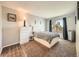 Cozy bedroom with plush carpet, neutral walls, and a large window at 15911 E Dakota Pl # 301, Aurora, CO 80017