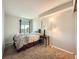 Comfortable bedroom with carpet flooring, a side window, and plenty of space at 15911 E Dakota Pl # 301, Aurora, CO 80017