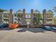 Apartment building with brick chimney stacks and balconies overlooking the parking area at 15911 E Dakota Pl # 301, Aurora, CO 80017