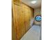 Unique hallway featuring paneled doors and a distinctive porthole window providing natural light at 15911 E Dakota Pl # 301, Aurora, CO 80017