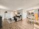 Inviting living room with hardwood floors and open concept kitchen/dining area at 15911 E Dakota Pl # 301, Aurora, CO 80017