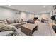 Basement media room with plush carpet, comfortable seating, and ample space for entertaining at 6538 S Lee Ct, Centennial, CO 80121