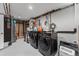 Laundry room featuring modern appliances and storage solutions at 6538 S Lee Ct, Centennial, CO 80121