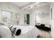 Spacious bedroom with a king-size bed and access to a private balcony at 475 W 12Th Ave # 6B, Denver, CO 80204