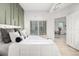 Main bedroom with a king-size bed and access to a private balcony at 475 W 12Th Ave # 6B, Denver, CO 80204