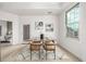 Bright dining area with modern table and chairs, offering access to a private balcony at 475 W 12Th Ave # 6B, Denver, CO 80204