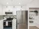 Modern kitchen with stainless steel appliances and ample cabinet space at 475 W 12Th Ave # 6B, Denver, CO 80204