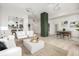 Modern living room with open floor plan, stylish furniture, and large windows at 475 W 12Th Ave # 6B, Denver, CO 80204