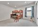 Bedroom featuring a wooden bunk bed, plush carpeting, and a window with playful character-themed curtains at 765 Tarragon Rd, Brighton, CO 80640