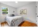 Cozy bedroom with hardwood floors, a large window, and neutral-toned decor at 3346 W 33Rd Ave, Denver, CO 80211