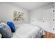 Bright bedroom with white walls, a window, and comfortable bedding at 3346 W 33Rd Ave, Denver, CO 80211