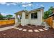 Beautiful exterior with white brick, landscaping, nice porch, and walkway leading to the front door at 3346 W 33Rd Ave, Denver, CO 80211