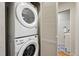 Convenient stacked washer and dryer in a dedicated laundry area with easy access to the bathroom at 3346 W 33Rd Ave, Denver, CO 80211